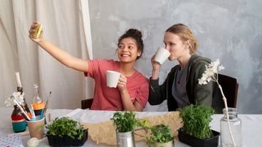 Young adult reusing cans for planting