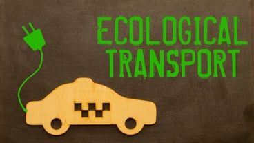 On a whitegreen surface a car and a cardboard sign with the inscription Ecologically Clean Transport