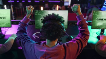 Back view man winning at videogame