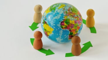Farmers in a circle around the earth - concept of globalization and teamwork