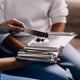Doctor and patient sitting and talking at medical examination at hospital office closeup Therapist filling up medication history records Medicine and healthcare concept