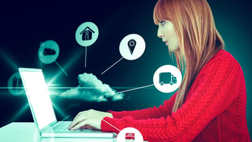 Composite image of smiling hipster woman using laptop