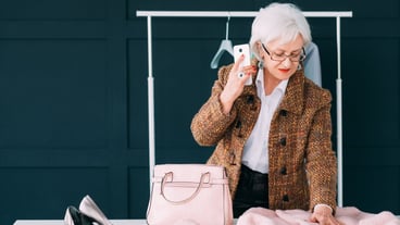 fashion consultant in showroom. senior trendy woman. personal stylist at work