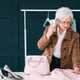 fashion consultant in showroom. senior trendy woman. personal stylist at work