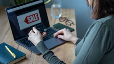Caucasian woman in home office works and pays online, internet surfing shopping online. pay by bank card, modern payment methods, electronic payments online payments