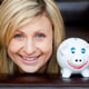 Portrait of a beautiful woman with a piggy bank