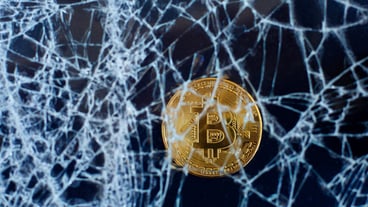 Bitcoin and cracked glass. The fall of bitcoin. Crash Collapse