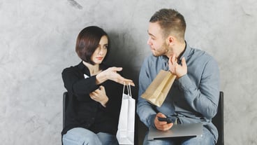 European man and woman with shopping bags