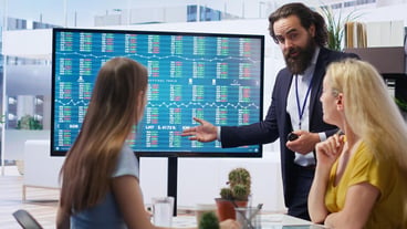 Broker in office assisting family with ipo forex portfolio management