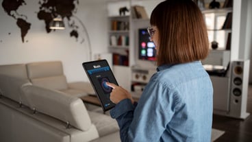 Young woman using home technology