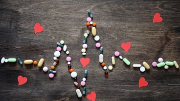 The concept of medical care for heart disease cardiac rhythm in the chart of tablets