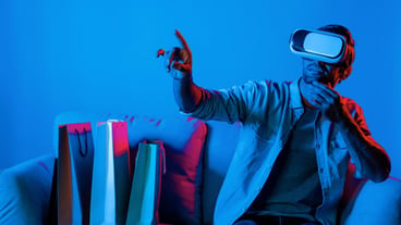 Caucasian man with vr glass choosing program while sitting at sofa deviation