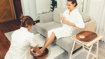Woman indulges in blissful foot massage at luxurious spa salon Quiescent