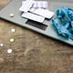 Measuring tape, pills and scales on wooden background.