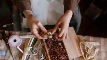 Close up hands holding wooden piece