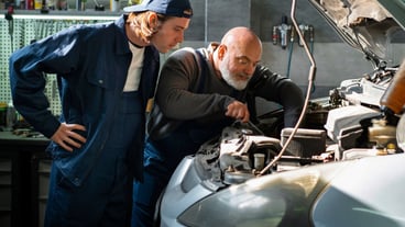 Male car mechanic working in the car repair shop