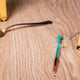 A drug syringe next to a police sign on the floor of the house. The concept of crime.