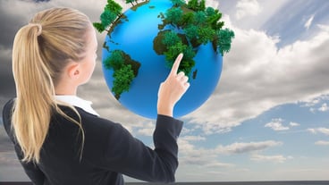 Composite image of blonde businesswoman pointing somewhere