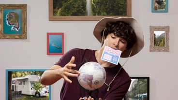 Traveler holding world globe front view
