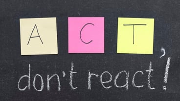 ACT, do not react phrase handwritten on blackboard