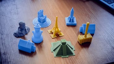 Bright objects printed using a 3D printer, as seen in a close-up. An automated 3D printer performs plastic modeling in the lab. Advanced modern additive manufacturing technology.