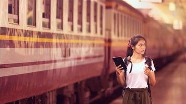 Young woman at railroad station platform