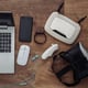 Modern youth equipment and devices on a wooden background. View from above. Lay flat
