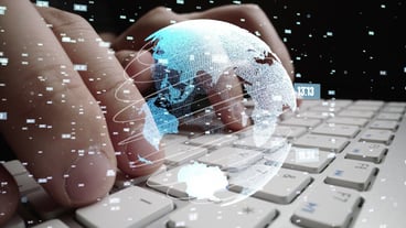 Man working on computer with graphic of mathematics coding modernization