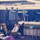 Multiethnic startup business team on meeting in modern bright office interior brainstorming, working on laptop and tablet computer