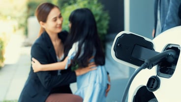 Focus home charging station for EV car blur progressive family in background