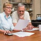 Senior couple working out their bills