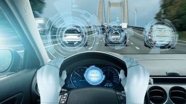 Driverless electric car without driver on a city street. Autonomous self driving mode.