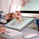 Graphic designer working with digital drawing tablet in the studio workplace.