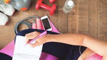 Top view healthy woman planning daily workout at home, Diet and fitness concept
