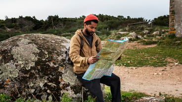 Full shot man holding map
