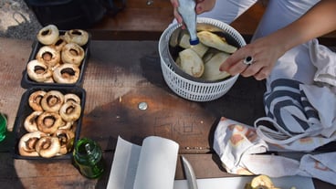 High angle view of people preparing food on table