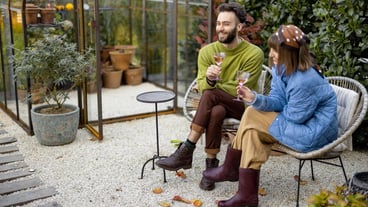 Young couple have romantic evening time with wine by the fire