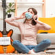 Woman in apartment with guitar