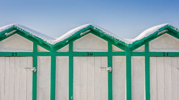Close-up of blue wall against clear sky