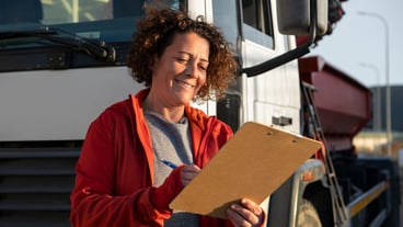 Professional female driver with van or wagon car