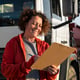 Professional female driver with van or wagon car