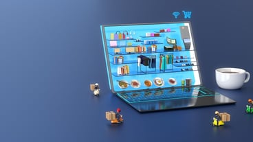 Shopping mall online in laptop with delivery man and a cup of coffee