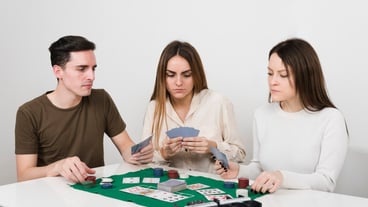 Front view friends playing poker