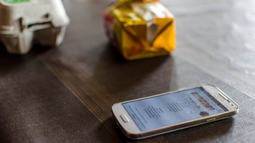 High angle view of broken smart phone on table