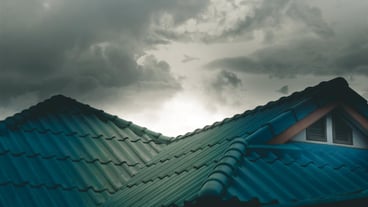 Low angle view of building against cloudy sky