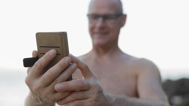 Portrait of young man holding camera