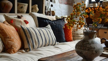 A bunch of pillows on a couch in a room