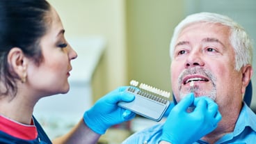 Dentist examines a patient in the clinic