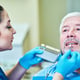 Dentist examines a patient in the clinic