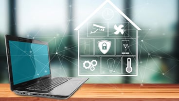 Smart home icons on virtual screen and laptop